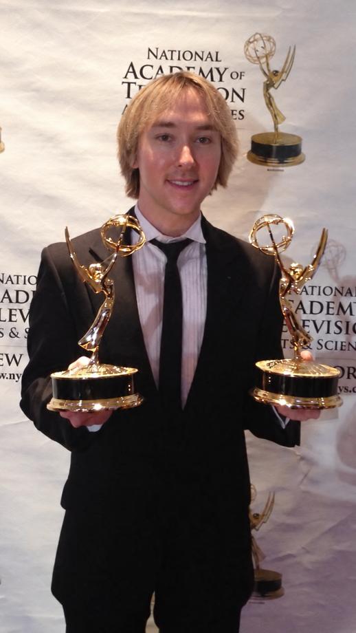 Michael Alden holding two Emmy Awards
